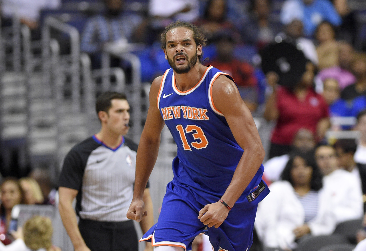 New York Knicks center Joakim Noah (13) reacts during the second half of a preseason NBA basketball game against the Washington Wizards, Friday, Oct. 6, 2017, in Washington. The Wizards won 104-100. (AP Photo/Nick Wass)