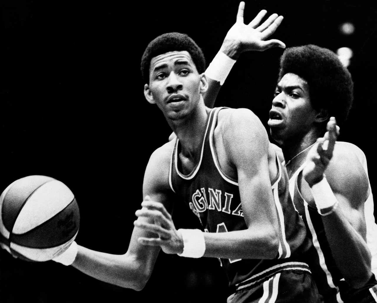 Larry Kenon of the New York Nets, right, stays close to George Gervin of the Virginia Squires Friday, Dec. 22, 1973 at Nassau Coliseum in Uniondale, N. Y. The Nets won the American Basketball Association game 115-100. (AP Photo/Ray Stubblebine)