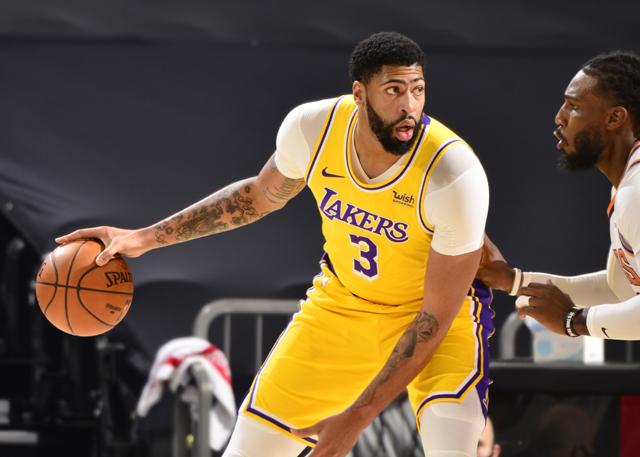 PHOENIX, AZ - DECEMBER 18: Anthony Davis #3 of the Los Angeles Lakers handles the ball against the Phoenix Suns during a preseason game on December 18, 2020 at Talking Stick Resort Arena in Phoenix, Arizona. NOTE TO USER: User expressly acknowledges and agrees that, by downloading and or using this photograph, user is consenting to the terms and conditions of the Getty Images License Agreement. Mandatory Copyright Notice: Copyright 2020 NBAE (Photo by Barry Gossage/NBAE via Getty Images)