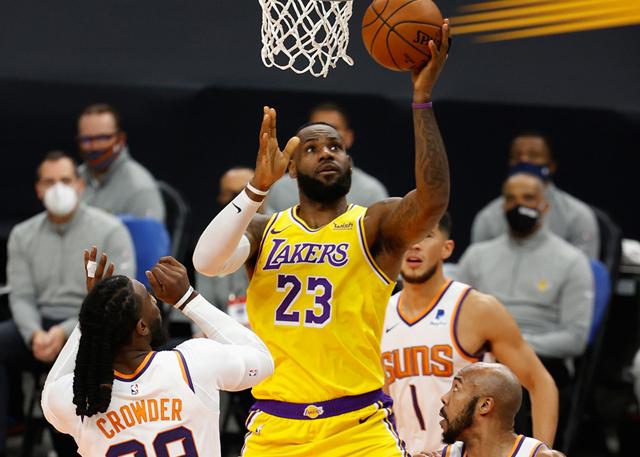 PHOENIX, ARIZONA - DECEMBER 18: LeBron James #23 of the Los Angeles Lakers attempts a shot over Jae Crowder #99 of the Phoenix Suns during the first half of the NBA preseason game at Talking Stick Resort Arena on December 18, 2020 in Phoenix, Arizona. (Photo by Christian Petersen/Getty Images)