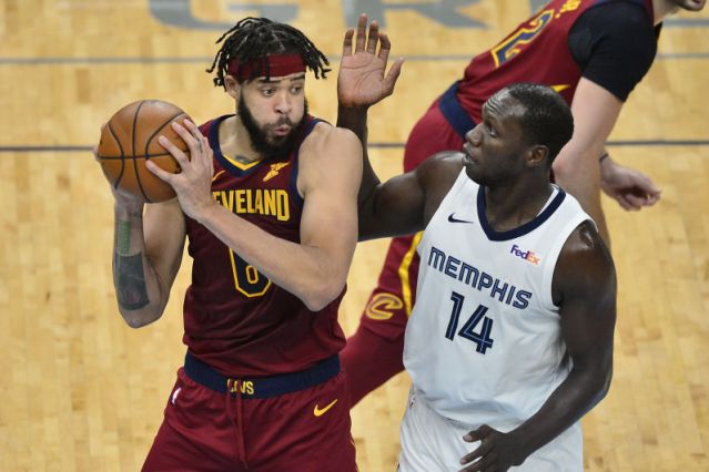 Cleveland Cavaliers center JaVale McGee (6) handles the ball against Memphis Grizzlies center Gorgui Dieng (14) in the second half of an NBA basketball game Thursday, Jan. 7, 2021, in Memphis, Tenn. (AP Photo/Brandon Dill)