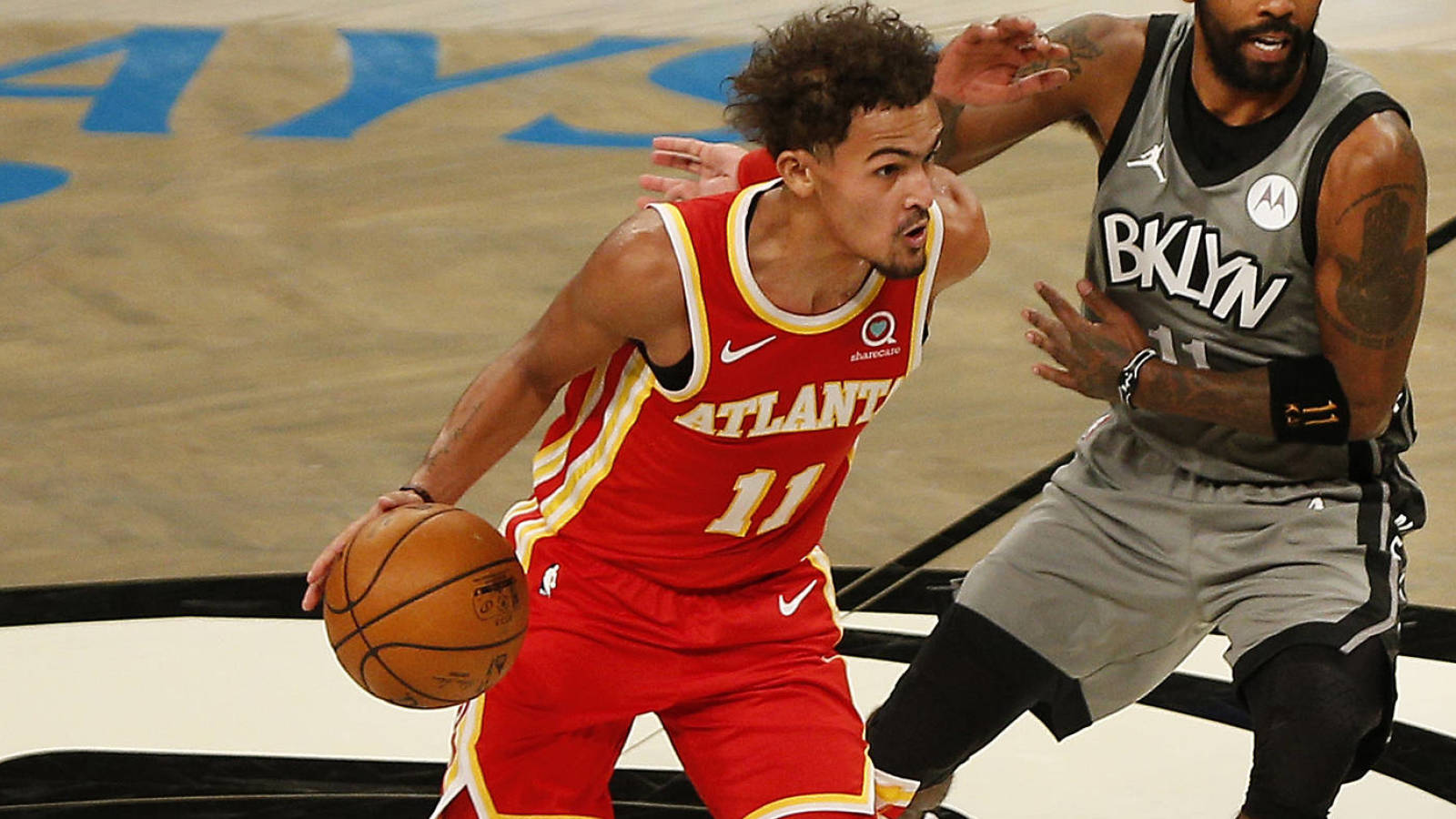 Dec 30, 2020; Brooklyn, New York, USA; Atlanta Hawks guard Trae Young (11) dribbles the ball while being defended by Brooklyn Nets guard Kyrie Irving (11) during the first half at Barclays Center. Mandatory Credit: Andy Marlin-USA TODAY Sports