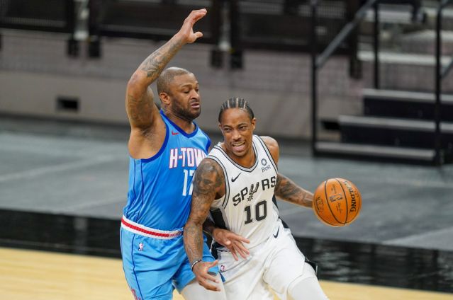 Jan 16, 2021; San Antonio, Texas, USA;  San Antonio Spurs forward DeMar DeRozan (10) drives around Houston Rockets forward P.J. Tucker (17) in the first half at the AT&T Center. Mandatory Credit: Daniel Dunn-USA TODAY Sports