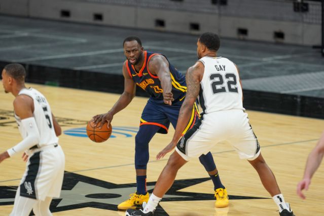 Feb 8, 2021; San Antonio, Texas, USA; Golden State Warriors forward Draymond Green (23) points in the second half against the San Antonio Spurs at the AT&T Center. Mandatory Credit: Daniel Dunn-USA TODAY Sports