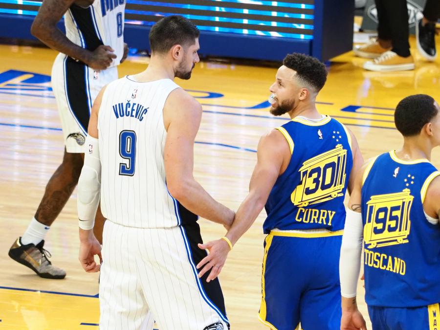 Feb 11, 2021; San Francisco, California, USA; Orlando Magic center Nikola Vucevic (9) and Golden State Warriors guard Stephen Curry (30) after the game at Chase Center. Mandatory Credit: Kelley L Cox-USA TODAY Sports