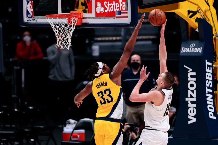 Mar 15, 2021; Denver, Colorado, USA; Indiana Pacers center Myles Turner (33) blocks the shot of Denver Nuggets center Nikola Jokic (15) in the third quarter at Ball Arena. Mandatory Credit: Isaiah J. Downing-USA TODAY Sports