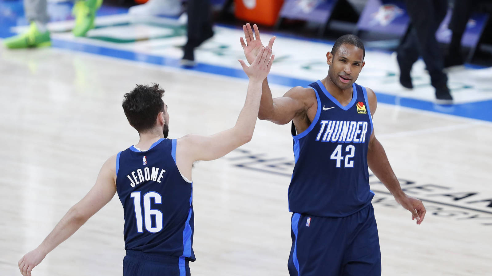 Mar 11, 2021; Oklahoma City, Oklahoma, USA; Oklahoma City Thunder center Al Horford (42) and guard Ty Jerome (16) high five following a dunk by Horford against the Dallas Mavericks during the second half at Chesapeake Energy Arena. Mandatory Credit: Alonzo Adams-USA TODAY Sports