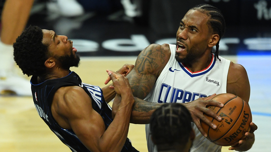 Mar 30, 2021; Los Angeles, California, USA; Los Angeles Clippers forward Kawhi Leonard (2) draws a foul from Orlando Magic guard Chasson Randle (25) as he drive to the basket during the second half at Staples Center. Mandatory Credit: Jayne Kamin-Oncea-USA TODAY Sports