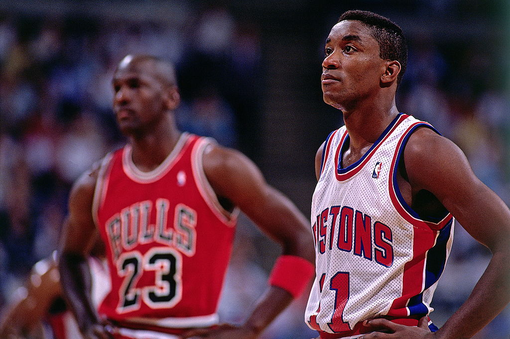 AUBURN HILLS, MI - 1989: Isiah Thomas #11 of the Detroit Pistons takes some time to catch his breath with Michael Jordan #23 of the Chicago Bulls during a break in the action during an NBA game at The Palace circa 1989 in Auburn Hills, Michigan. NOTE TO USER: User expressly acknowledges and agrees that, by downloading and/or using this Photograph, user is consenting to the terms and conditions of the Getty Images License Agreement. Mandatory Copyright Notice: Copyright 1989 NBAE (Photo by Andrew D. Bernstein/NBAE via Getty Images)