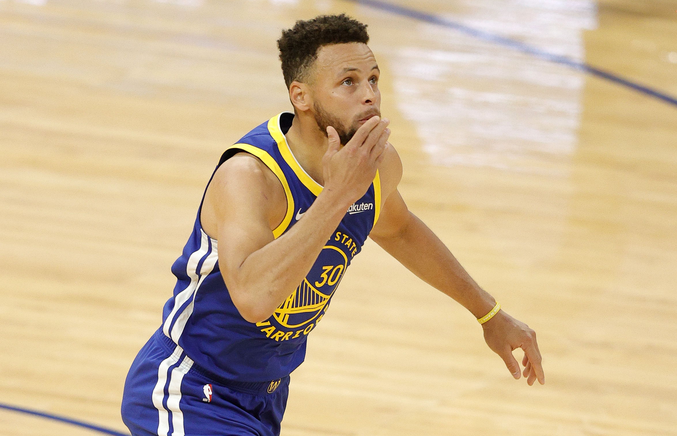 Stephen Curry #30 of the Golden State Warriors blows a kiss after he made a basket to pass Wilt Chamberlain as the Golden State Warriors all-time leading scorer during the first quarter of their game against the Denver Nuggets at Chase Center on April 12, 2021 in San Francisco, California. (Ezra Shaw/Getty Images/TNS)