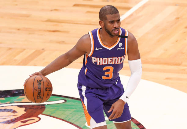 BOSTON, MA - APRIL 22: Chris Paul #3 of the Phoenix Suns dribbles during the game against the Boston Celtics at TD Garden on April 22, 2021 in Boston, Massachusetts. NOTE TO USER: User expressly acknowledges and agrees that, by downloading and or using this photograph, User is consenting to the terms and conditions of the Getty Images License Agreement. (Photo by Adam Glanzman/Getty Images)