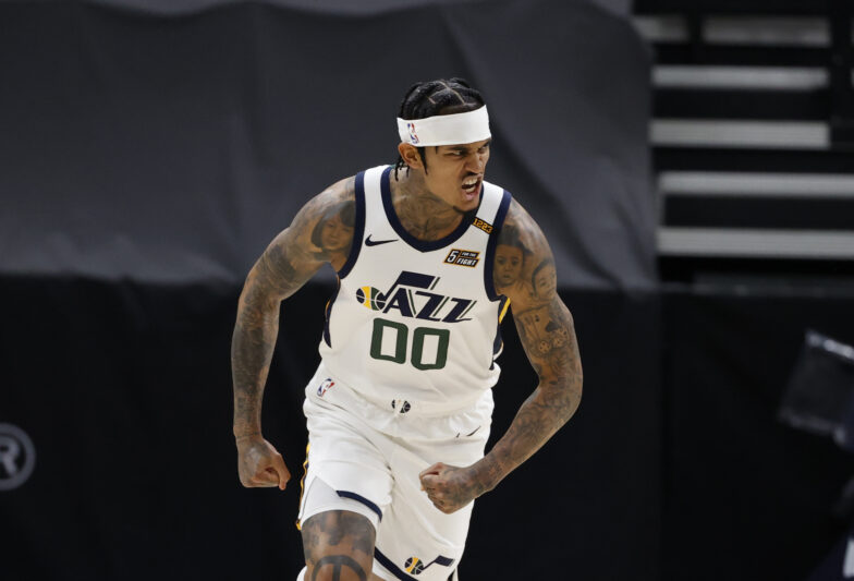 SALT LAKE CITY, UT - MARCH 26: Jordan Clarkson #00 of the Utah Jazz celebrates during the game against the Memphis Grizzlies on March 26, 2021 at vivint.SmartHome Arena in Salt Lake City, Utah. NOTE TO USER: User expressly acknowledges and agrees that, by downloading and or using this Photograph, User is consenting to the terms and conditions of the Getty Images License Agreement. Mandatory Copyright Notice: Copyright 2021 NBAE (Photo by Jeff Swinger/NBAE via Getty Images)