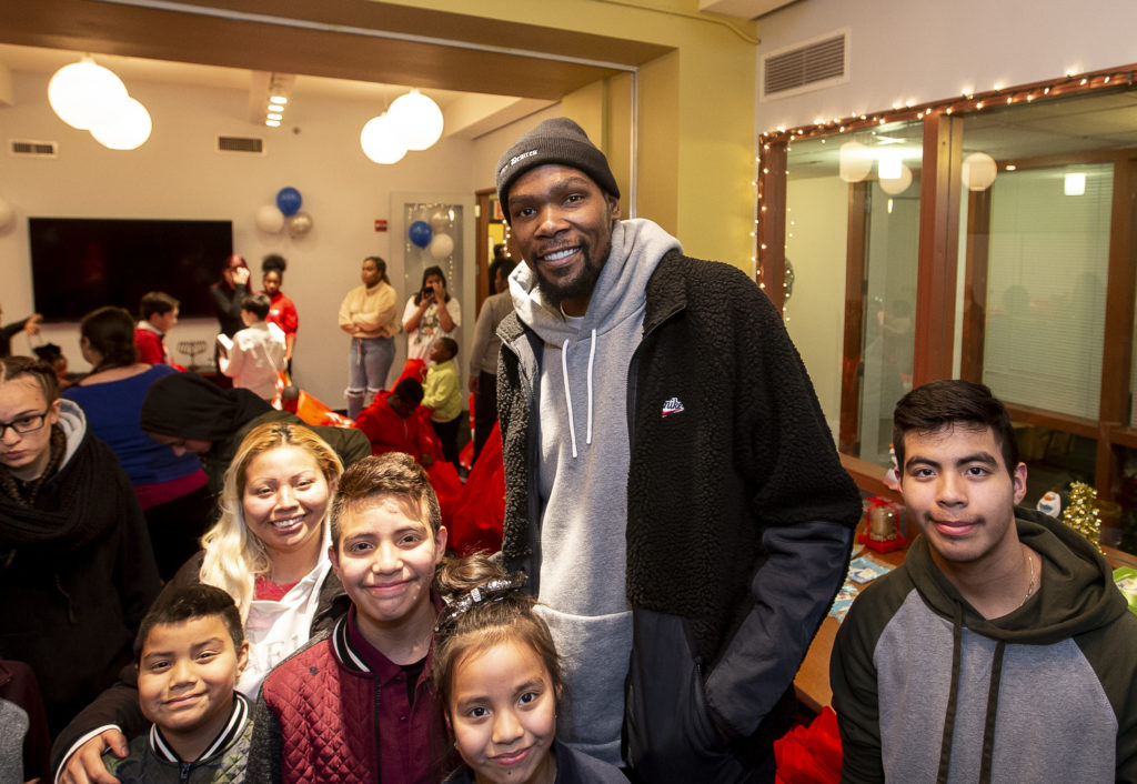 NEW YORK, NY - DECEMBER 19: Kevin Durant gives the CFTH’s Bound for Success program, which provides tutoring, homework help, and recreational and cultural activities every weekday for homeless youth ages 6 to 13 a special holiday surprise at the Coalition for the Homeless on  December 19, 2019 at Coalition for the Homeless in New York, NY (Photo by Michelle Farsi)