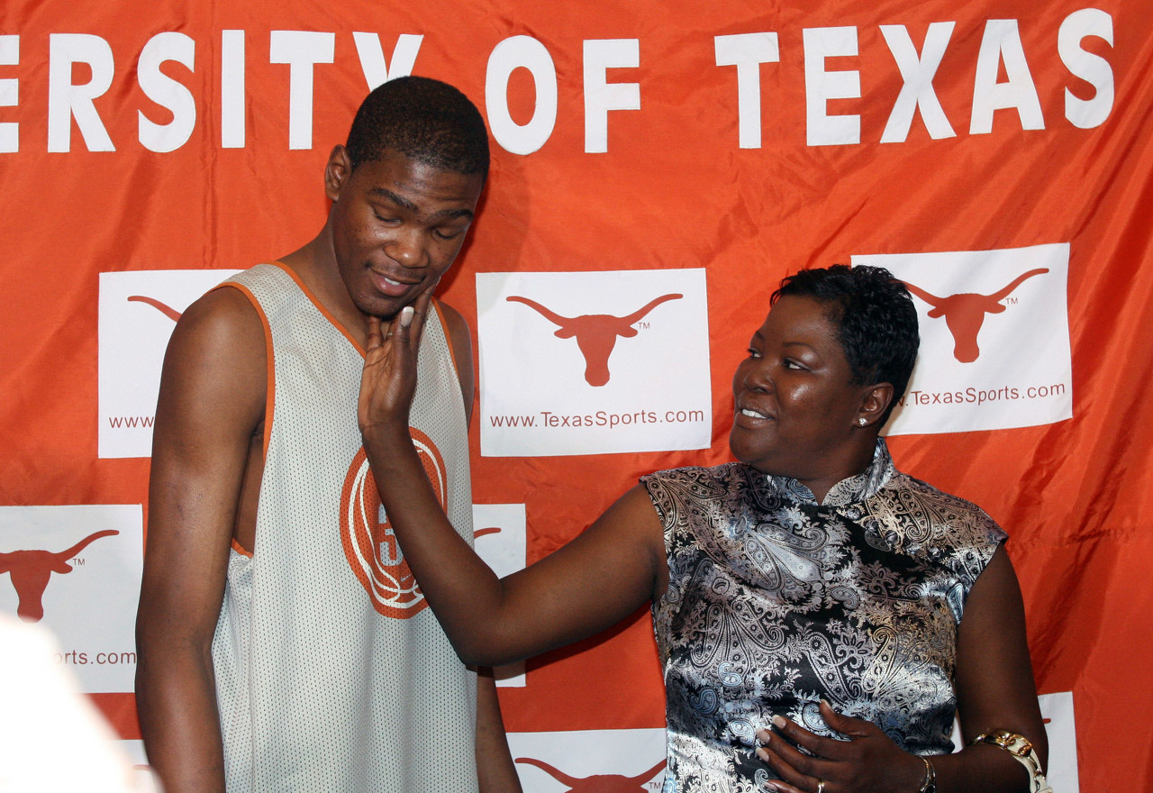 FILE - In this April 10, 2007, file photo, then-Texas basketball forward Kevin Durant, left, gets a pat from his mother, Wanda Pratt, after he announced he would enter the NBA draft during a news conference in Austin, Texas. Durant's mother, Wanda, is the subject of a Lifetime original movie called The Real MVP: The Wanda Durant Story, which will premiere on May 7. (AP Photo/Jack Plunkett, File)