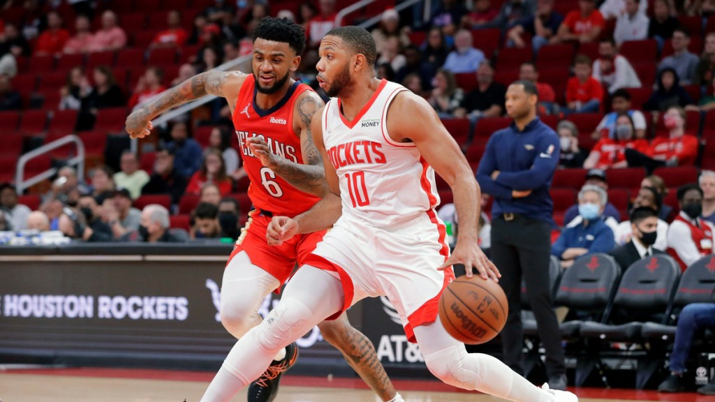 Houston Rockets guard Eric Gordon (10) drives around New Orleans Pelicans guard Nickeil Alexander-Walker (6) during the second half of an NBA basketball game, Sunday, Dec. 5, 2021, in Houston. (AP Photo/Michael Wyke)