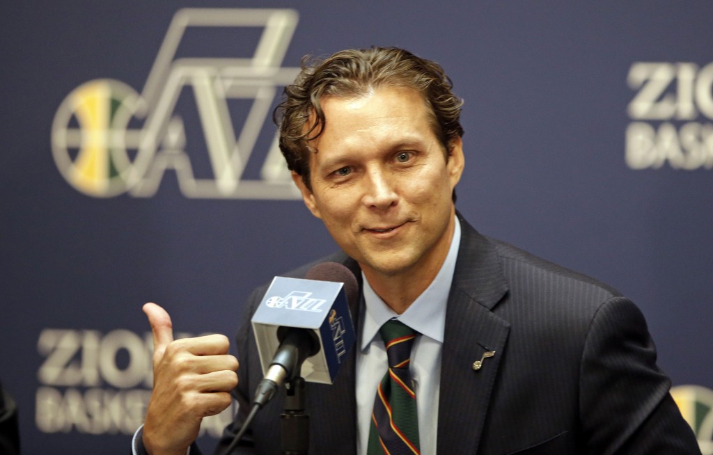 Quin Snyder gestures fter being introduced as the new Utah Jazz head coach during an NBA basketball news conference Saturday, June 7, 2014, in Salt Lake City. The Jazz announced Friday that they hired the Atlanta Hawks assistant coach to replace Tyrone Corbin, who was let go earlier this year after three-plus seasons in Salt Lake City.  (AP Photo/Rick Bowmer)