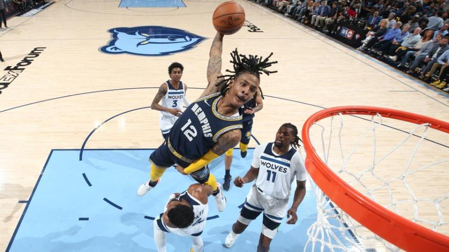 Grizzlies star Ja Morant throws down 'jaw-breaker' poster dunk of the playoffs vs. Timberwolves | Sporting News