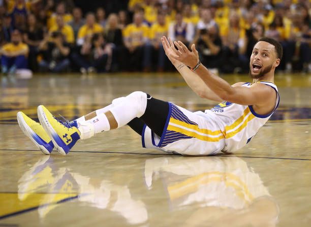 Stephen Curry of the Golden State Warriors reacts after drawing a foul on a threepoint attempt against the Utah Jazz during Game One of the NBA...